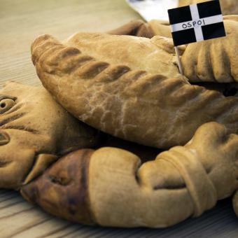 Up close shot of pasties and Cornish flag